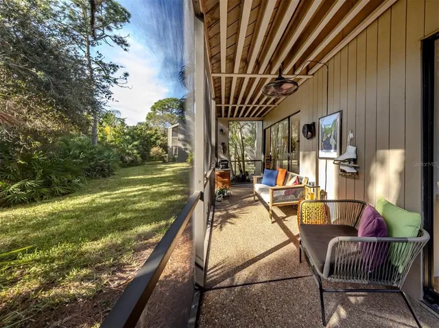 a view of a swimming pool with a garden and seating area