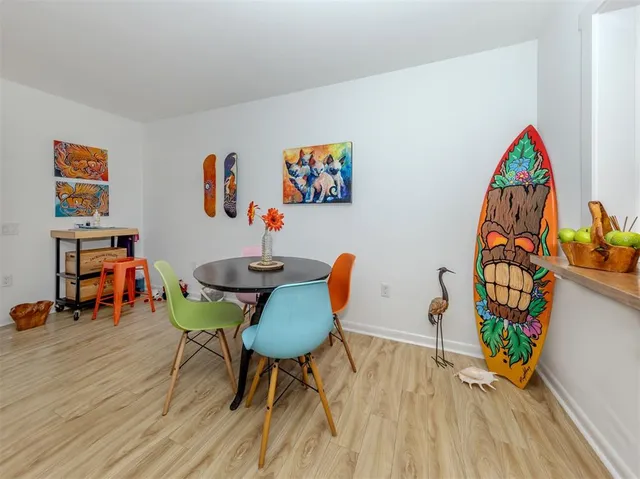 a living room with furniture a rug and a window