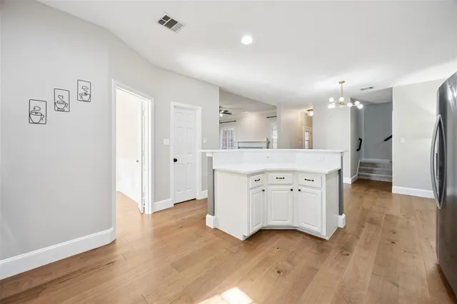 a kitchen with granite countertop a sink and a window
