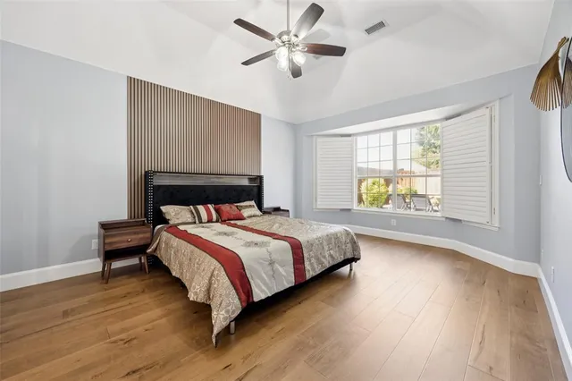 a view of swimming pool with table and chairs a fire pit