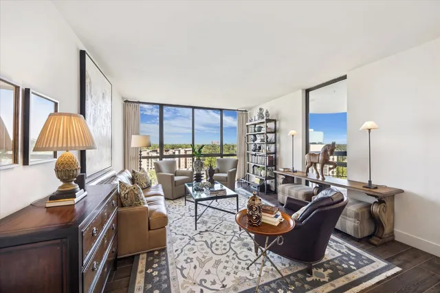 a living room with furniture and a lamp