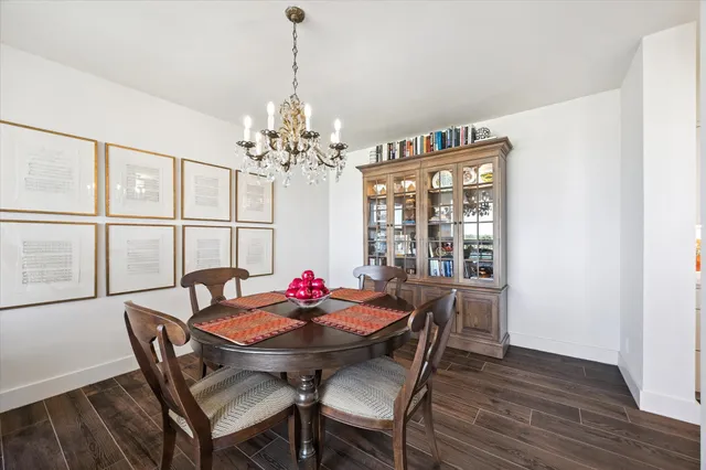 a kitchen with sink cabinets and dining table