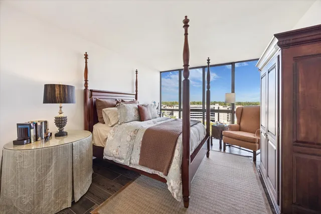 a bedroom with a bed a couch and dresser