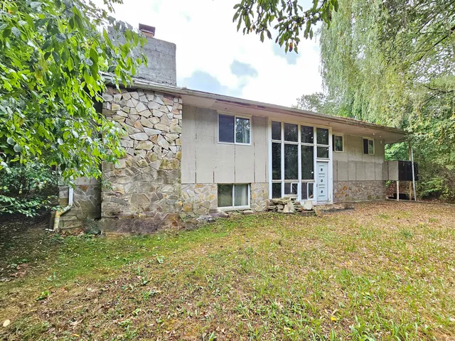front view of a house with a garden