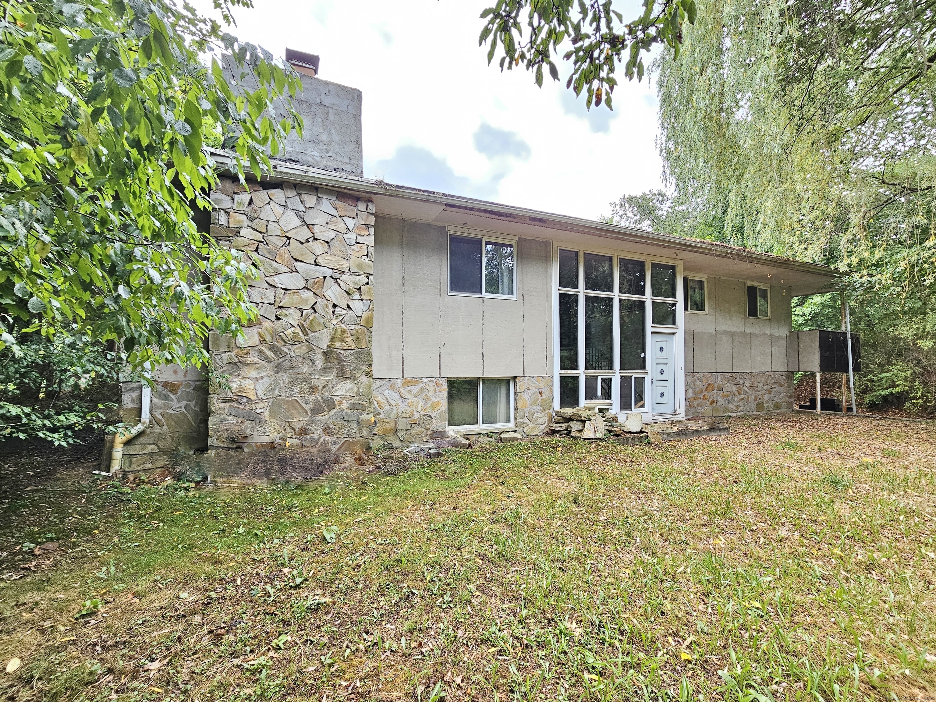 front view of a house with a garden