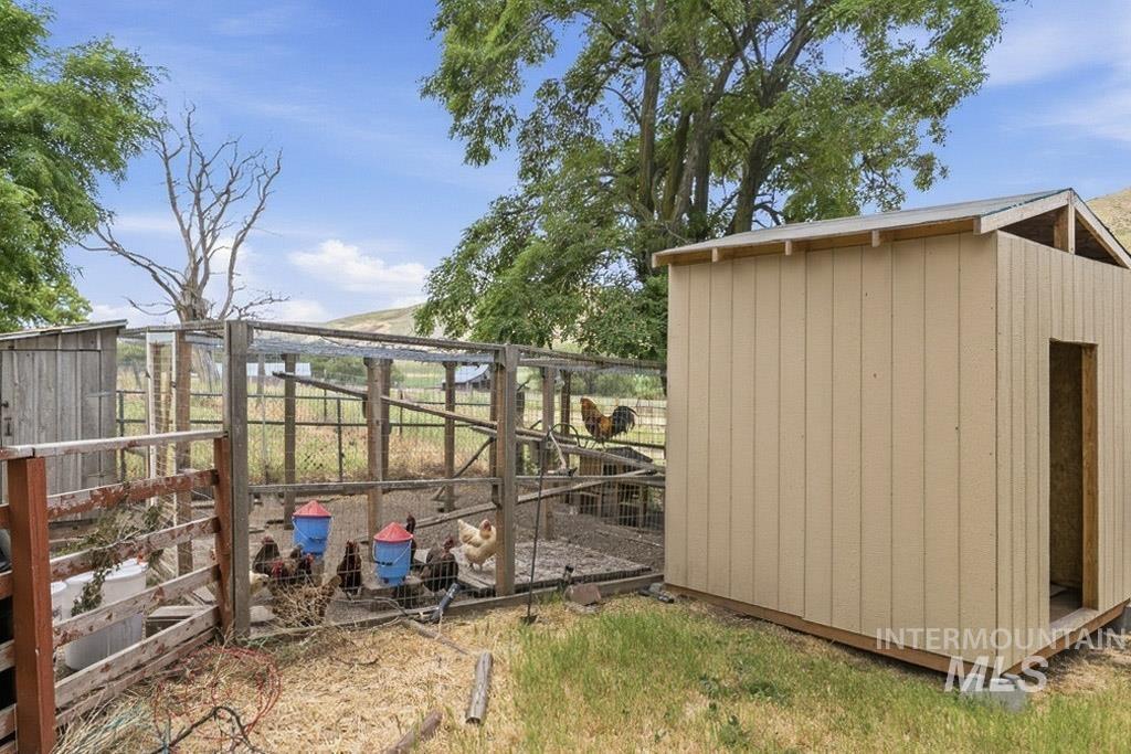 259 Highway 12 Pomeroy, WA 99347 - Photo 40 of 45 Exterior shed with light brown vertical siding and a partial open entryway