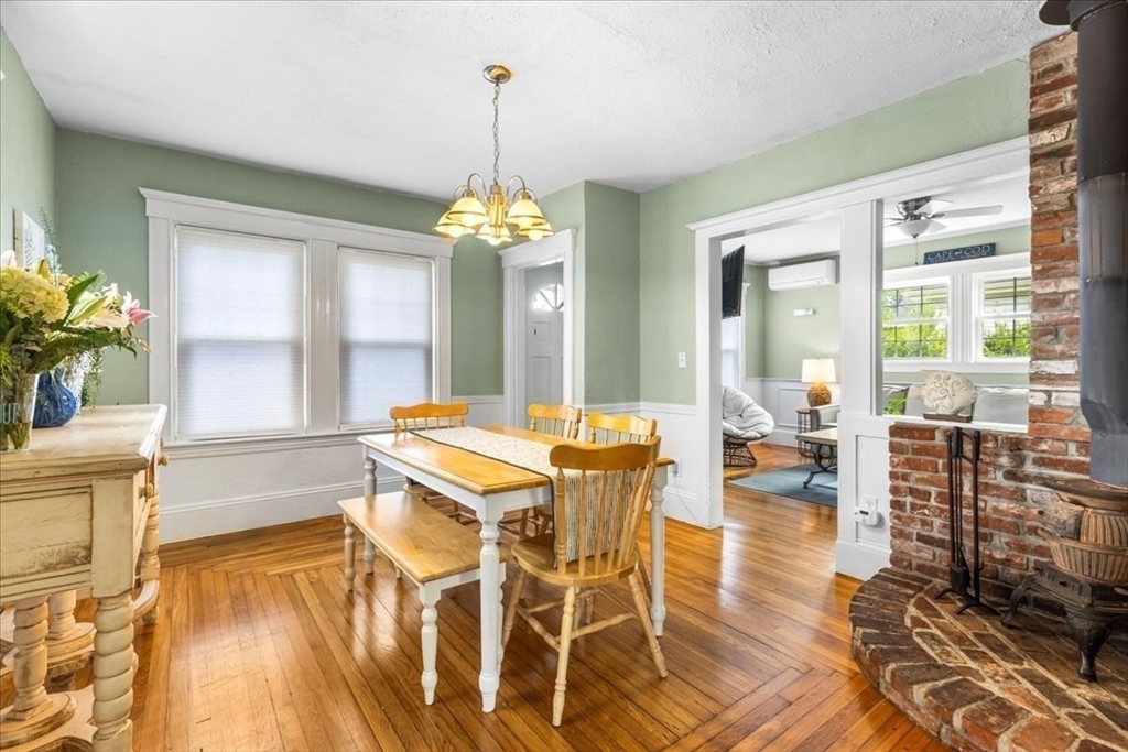 321 Winter Street Barnstable, MA 02601 - Photo 14 of 35 a view of a dining room with furniture wooden floor and chandelier