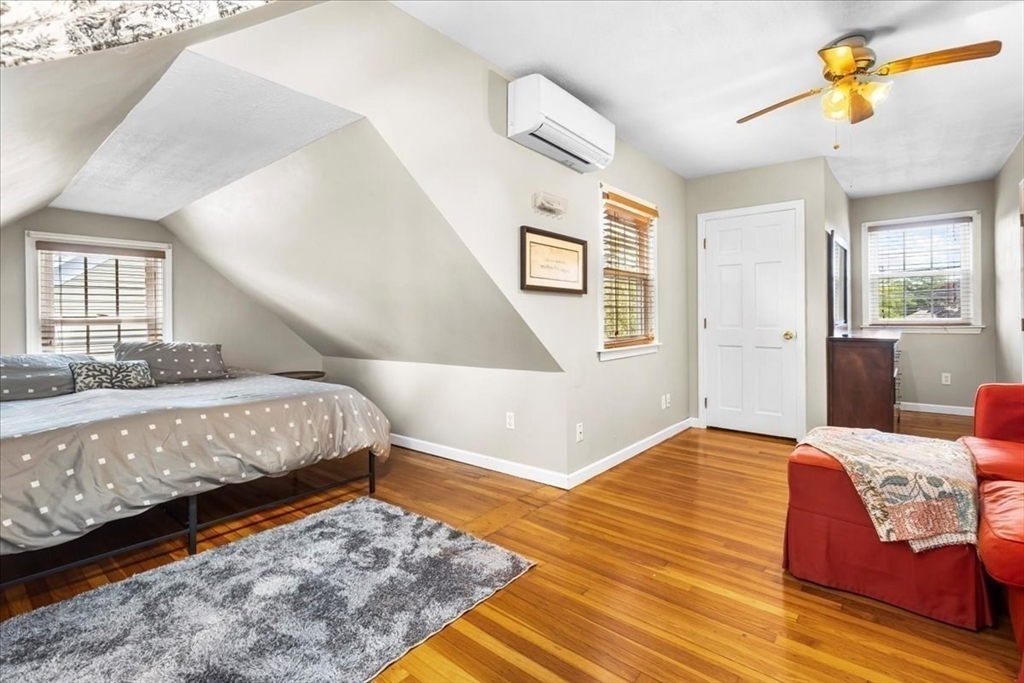 321 Winter Street Barnstable, MA 02601 - Photo 16 of 35 a bedroom with a bed and wooden floor