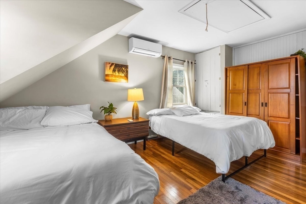 321 Winter Street Barnstable, MA 02601 - Photo 17 of 35 a bedroom with a bed and wooden floor