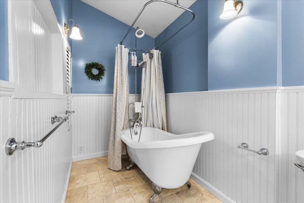 321 Winter Street Barnstable, MA 02601 - Photo 21 of 35 a bathroom with a bathtub and shower