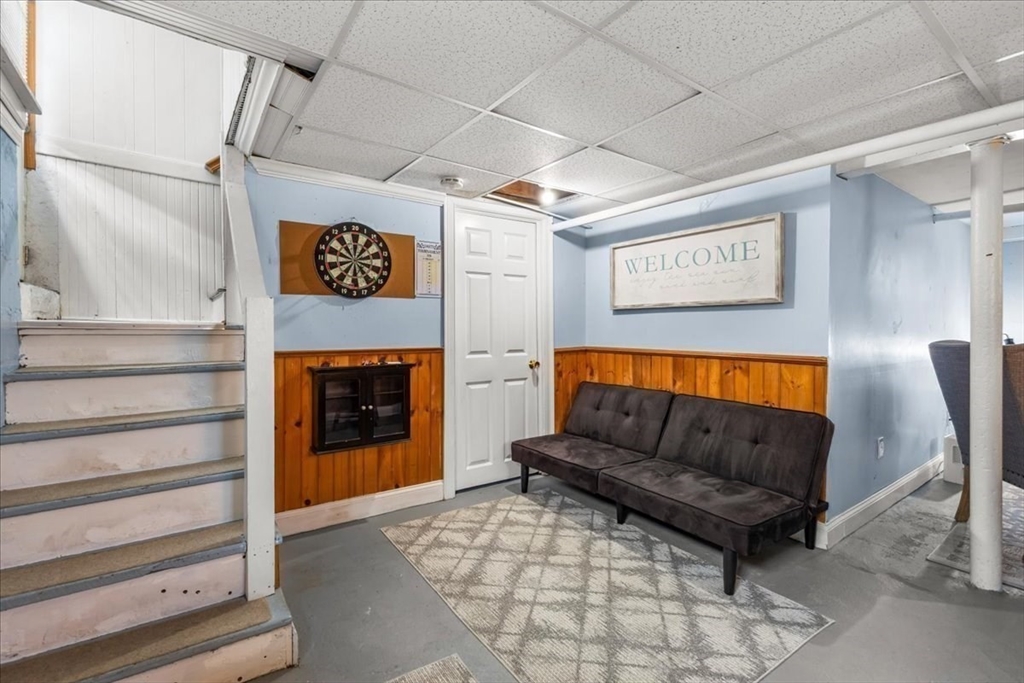 321 Winter Street Barnstable, MA 02601 - Photo 23 of 35 a living room with furniture and a fireplace