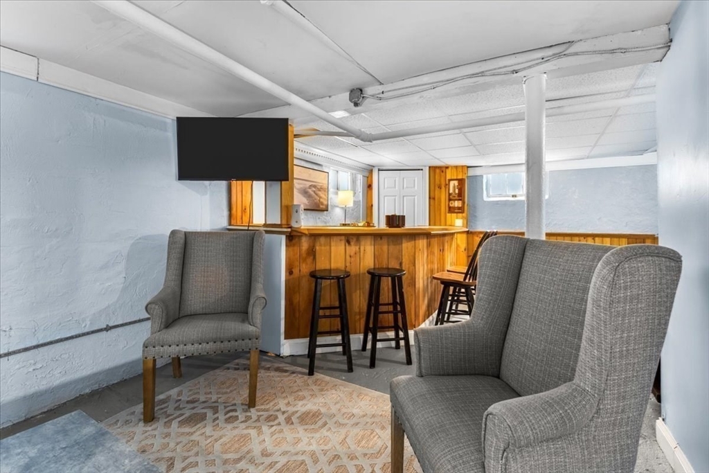 321 Winter Street Barnstable, MA 02601 - Photo 25 of 35 a living room with furniture and painting on the wall