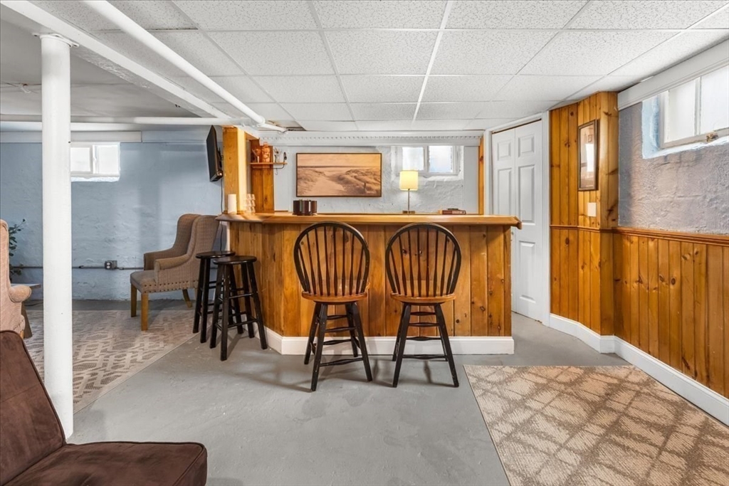 321 Winter Street Barnstable, MA 02601 - Photo 27 of 35 a balcony with table and chairs