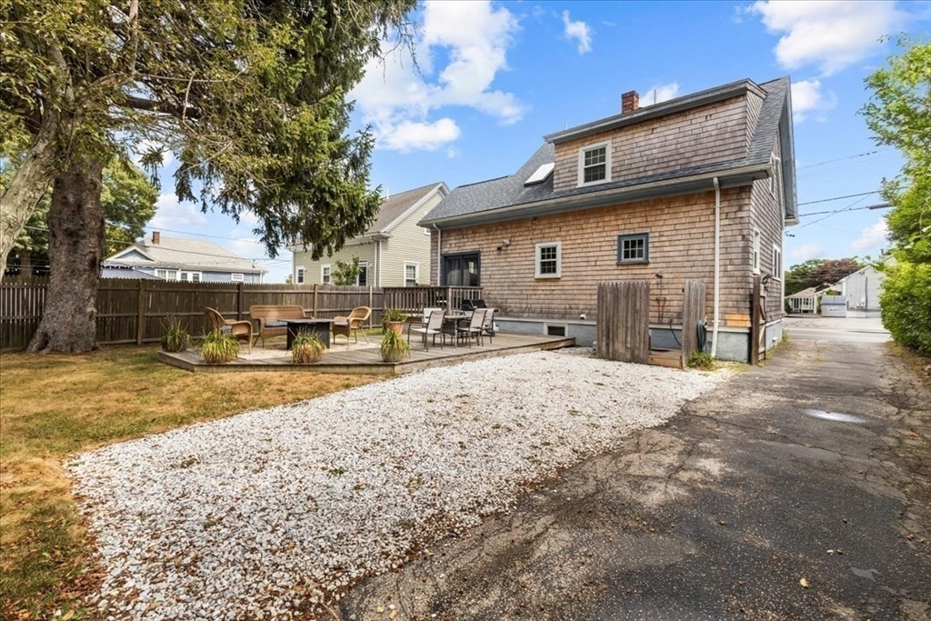 321 Winter Street Barnstable, MA 02601 - Photo 28 of 35 a view of a house with a yard covered in snow