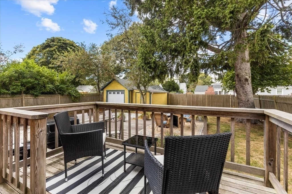 321 Winter Street Barnstable, MA 02601 - Photo 29 of 35 a view of roof deck with chairs and wooden fence