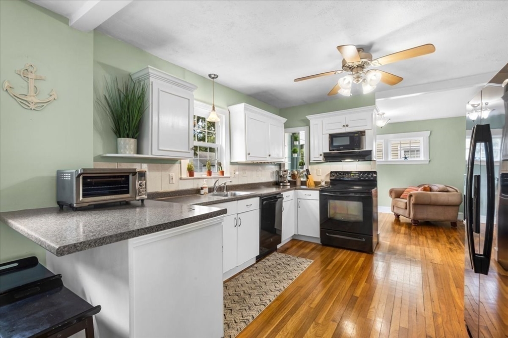 321 Winter Street Barnstable, MA 02601 - Photo 7 of 35 a kitchen with a sink appliances and cabinets