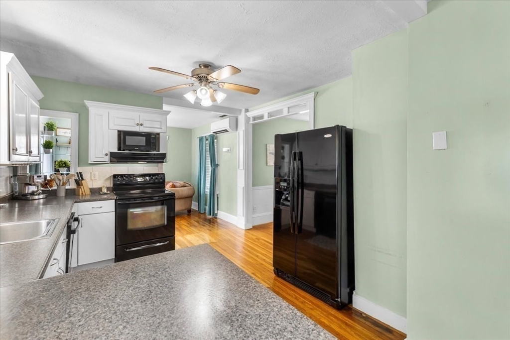 321 Winter Street Barnstable, MA 02601 - Photo 8 of 35 a kitchen with stainless steel appliances granite countertop a refrigerator a stove top oven a sink and dishwasher