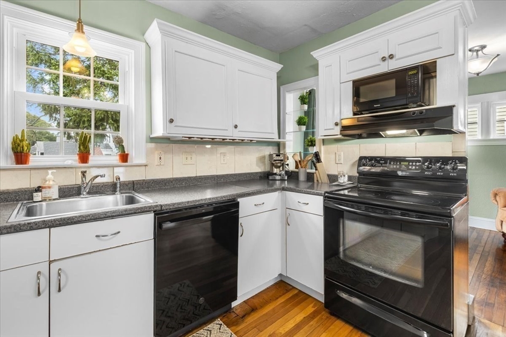 321 Winter Street Barnstable, MA 02601 - Photo 10 of 35 a kitchen with stainless steel appliances a stove sink and microwave