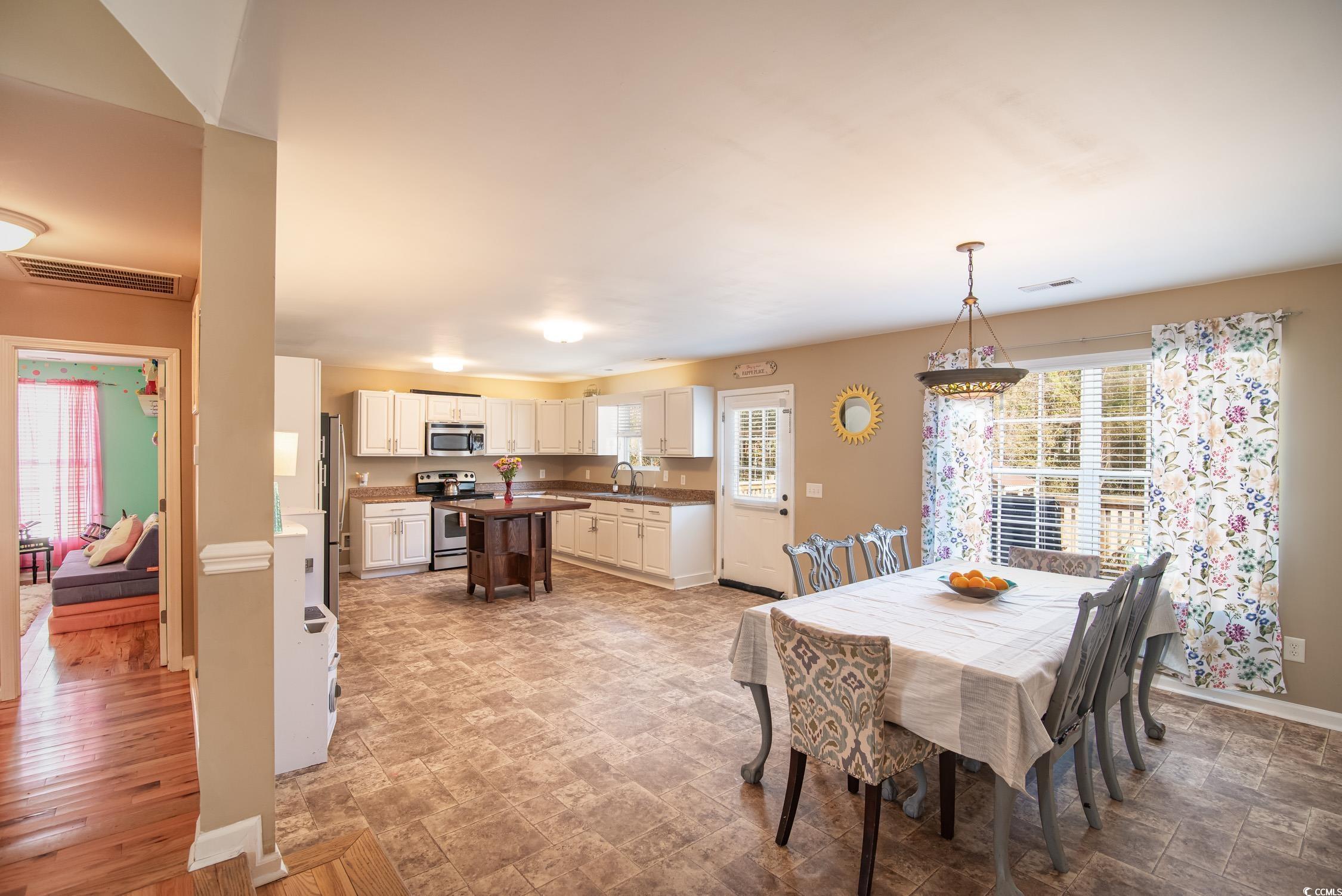 616 County Rd S-22-452 Georgetown, SC 29440 - Photo 13 of 33 Living room with ceiling fan and light hardwood /