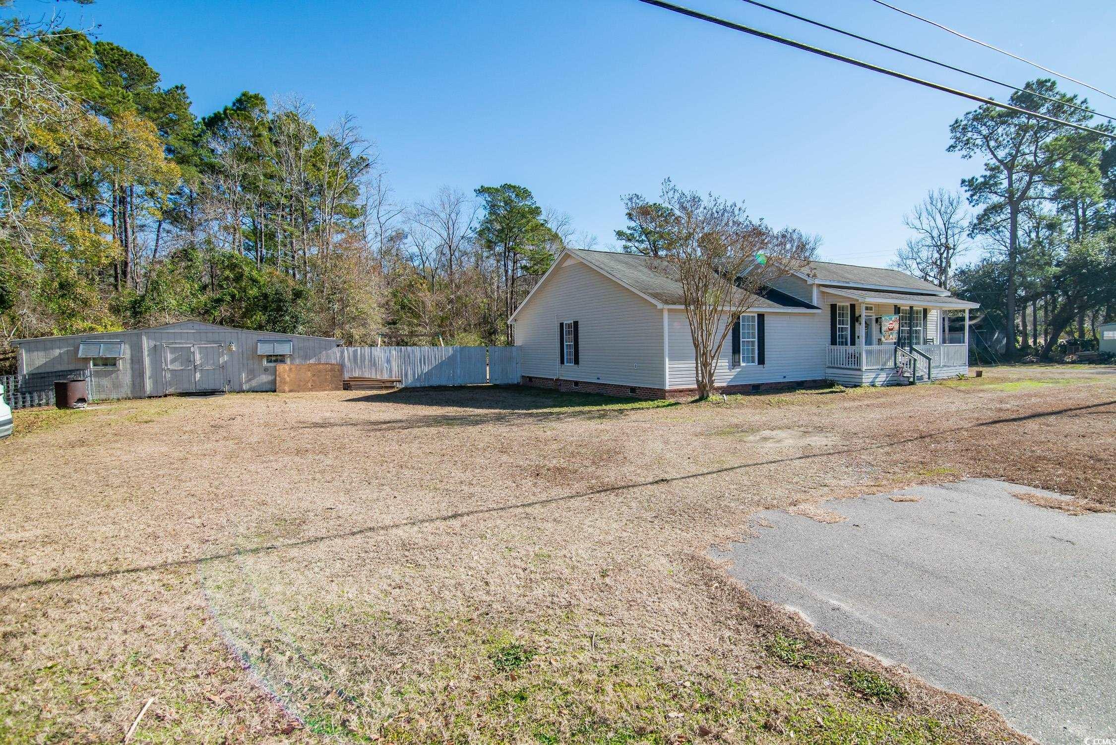 616 County Rd S-22-452 Georgetown, SC 29440 - Photo 2 of 33 View of property exterior with covered porch