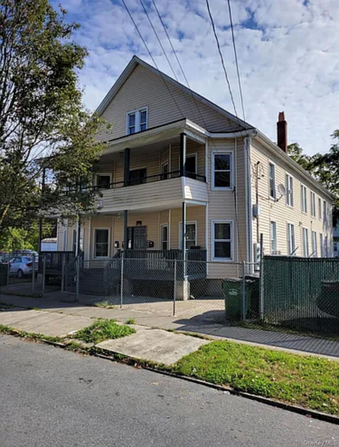 91 Pershing Avenue Poughkeepsie, NY 12601 - Photo 13 of 13 a front view of a house with a yard and garage