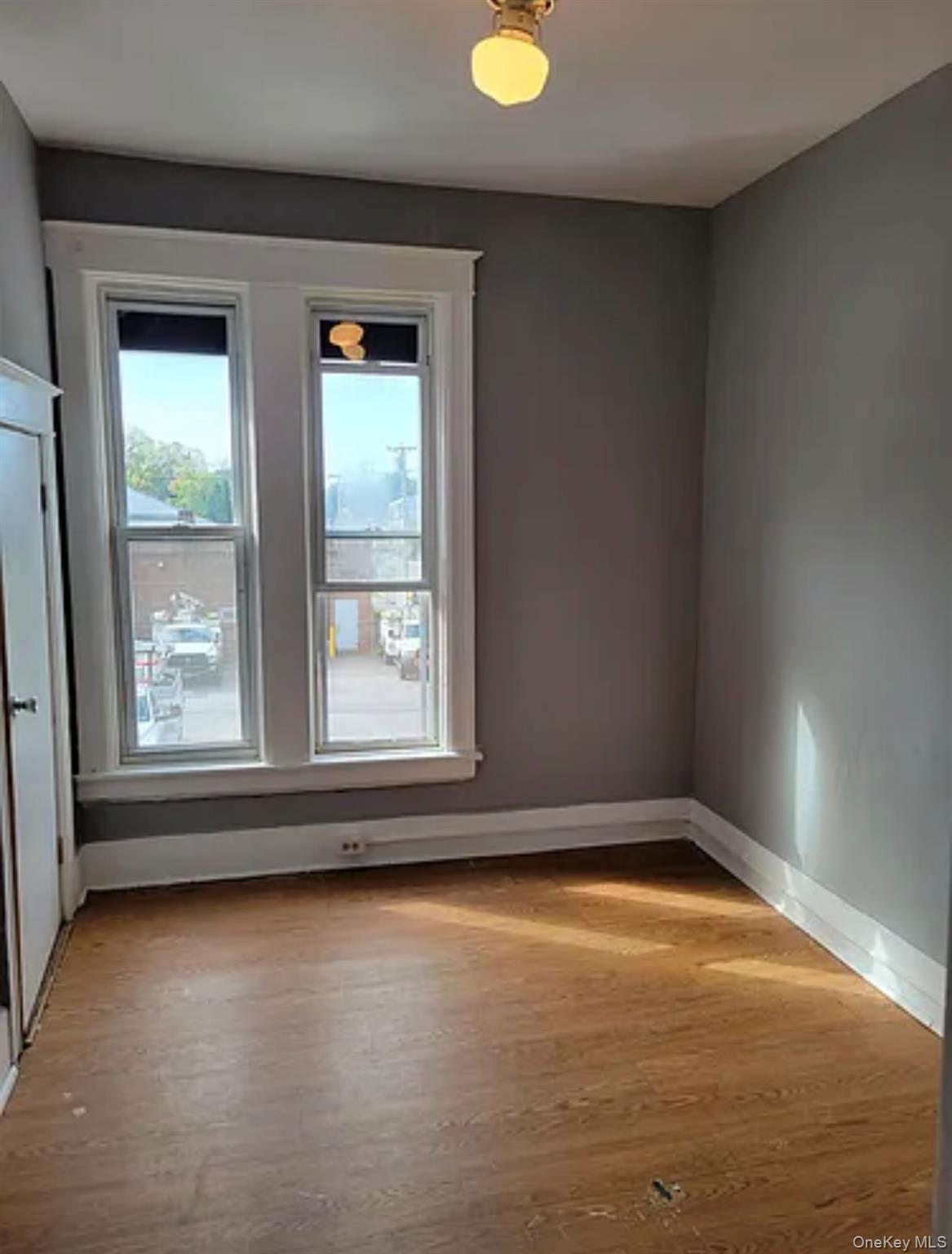 91 Pershing Avenue Poughkeepsie, NY 12601 - Photo 2 of 13 an empty room with a window