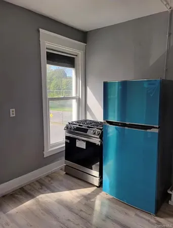 a kitchen with a stove and a refrigerator