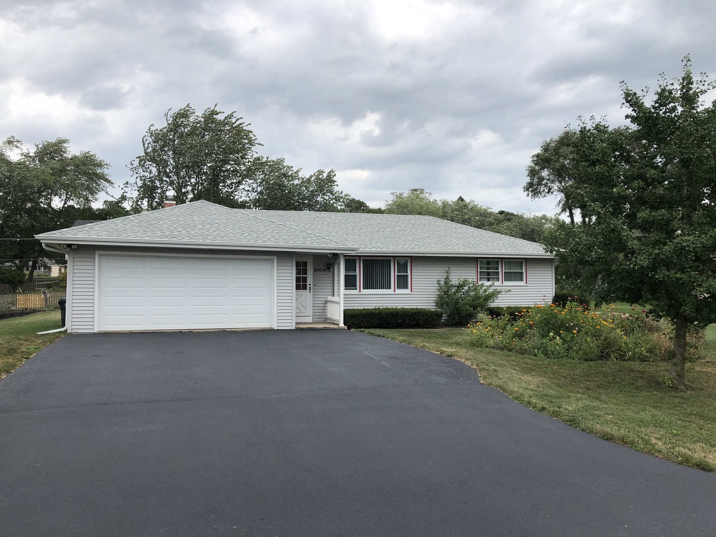 2004 Old Elm Road Lindenhurst, IL 60046 - Photo 1 of 19 a house that has tree in front of it