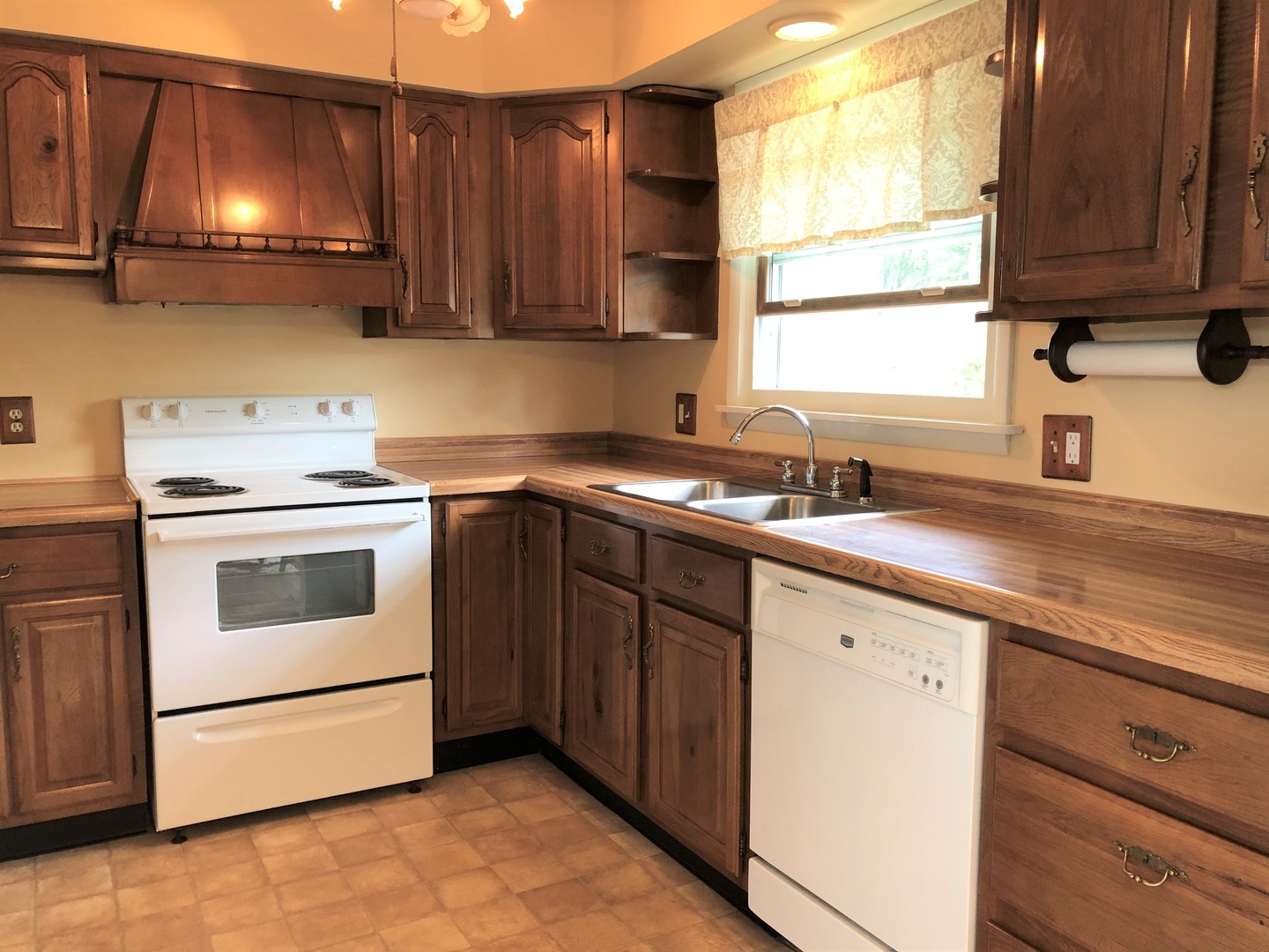 2004 Old Elm Road Lindenhurst, IL 60046 - Photo 4 of 19 a kitchen with a sink stove and cabinets