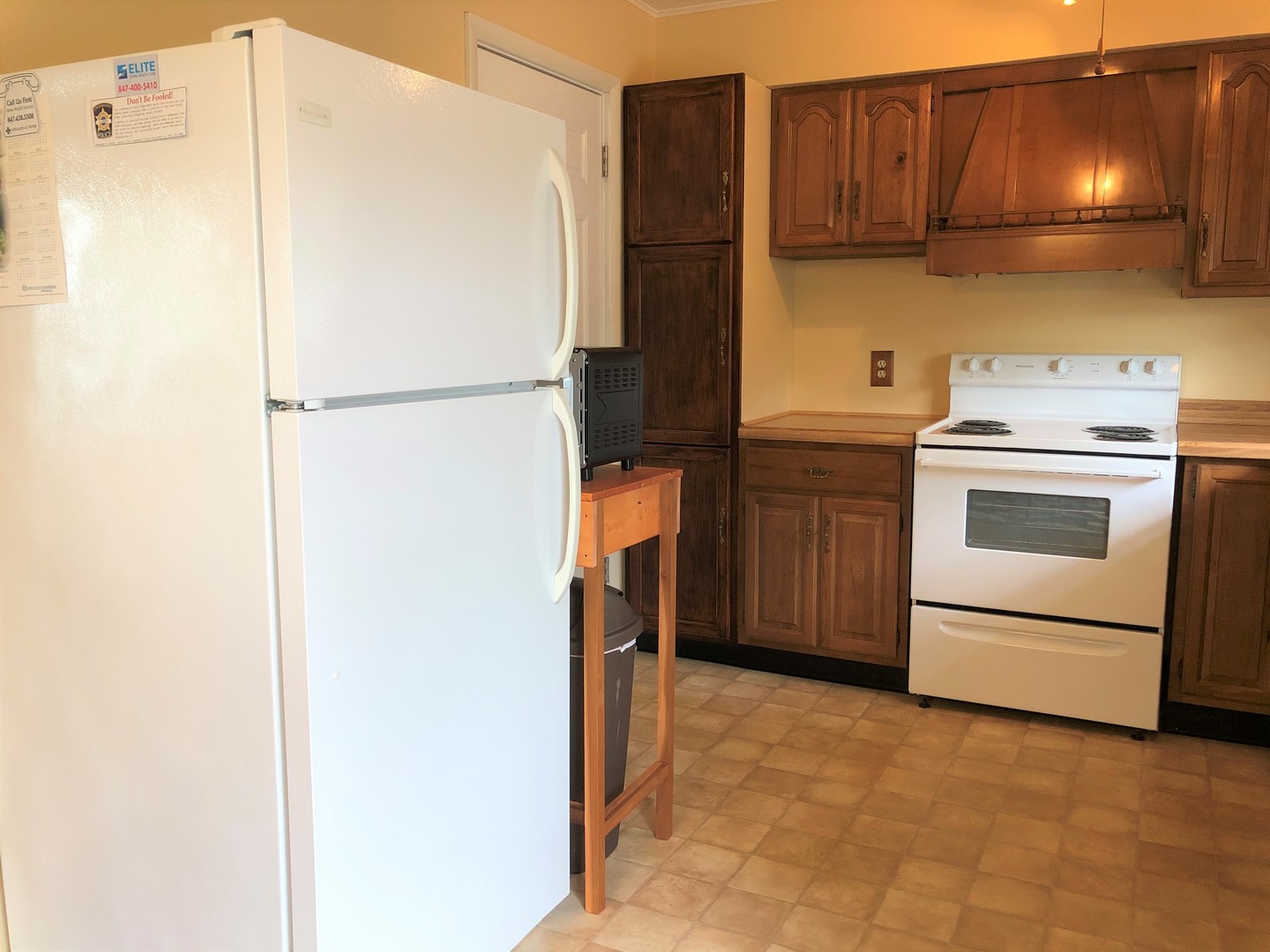 2004 Old Elm Road Lindenhurst, IL 60046 - Photo 6 of 19 a kitchen with a refrigerator and a stove