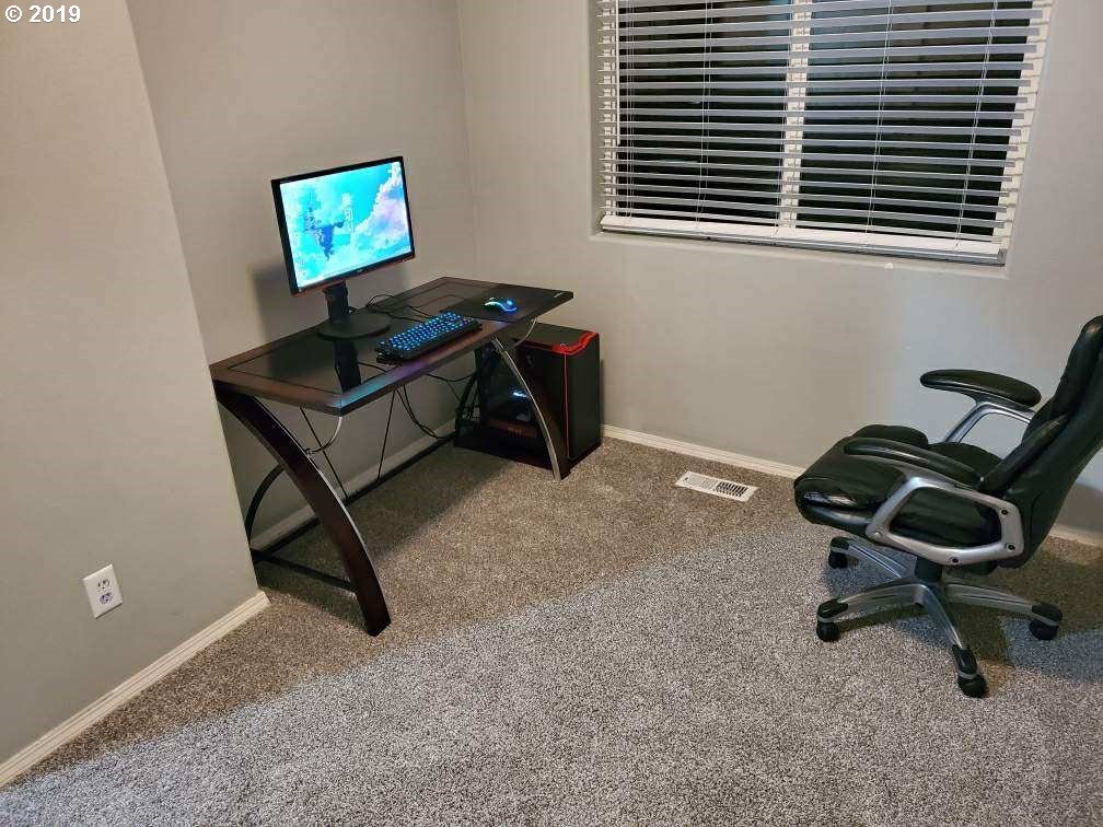 983 Southwest Junction Place Gresham, OR 97080 - Photo 5 of 10 a view of a workspace with a window