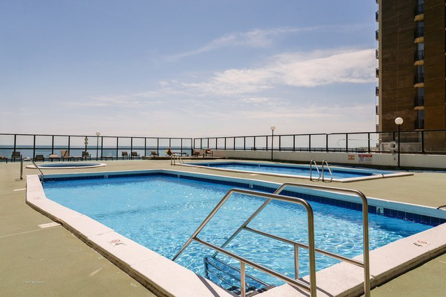 6033 North Sheridan Road, Unit 20K Chicago, IL 60660 - Photo 16 of 25 a view of swimming pool with outdoor seating