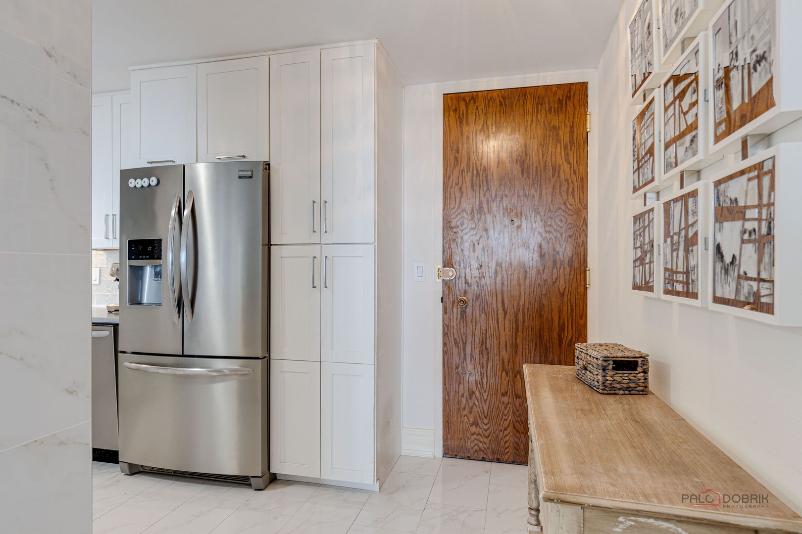 6033 North Sheridan Road, Unit 20K Chicago, IL 60660 - Photo 2 of 25 a kitchen with stainless steel appliances granite countertop a refrigerator and a sink