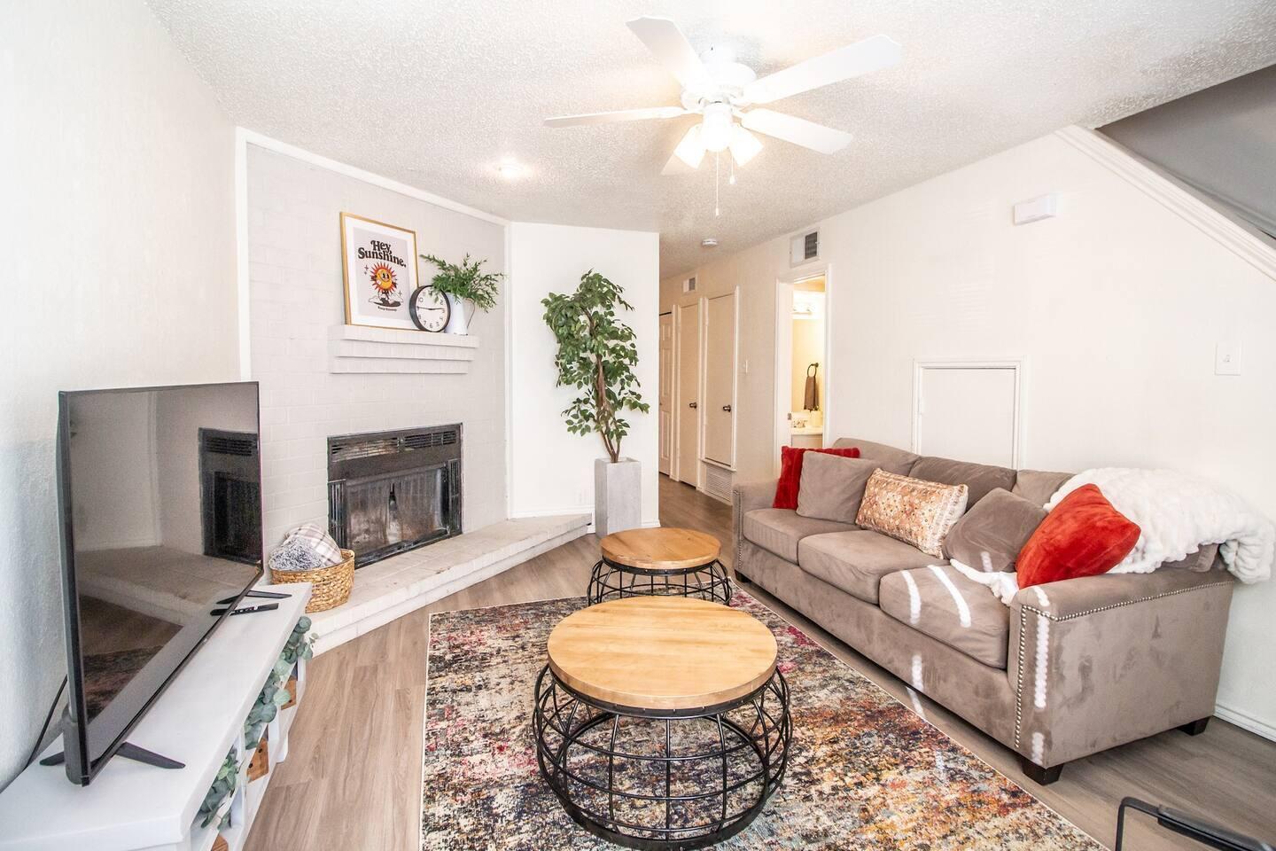 5806 6th Street, Unit B Lubbock, TX 79416 - Photo 25 of 45 a living room with furniture and a fireplace