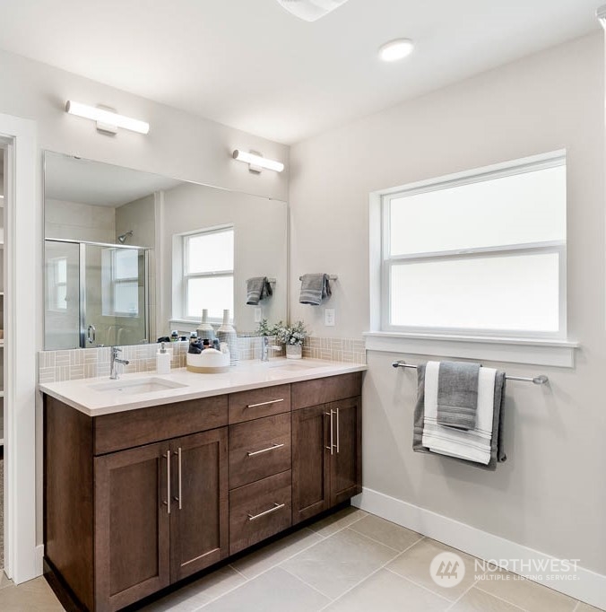 21523 6th Drive Southeast Bothell, WA 98021 - Photo 21 of 30 a bathroom with a double vanity sink and mirror