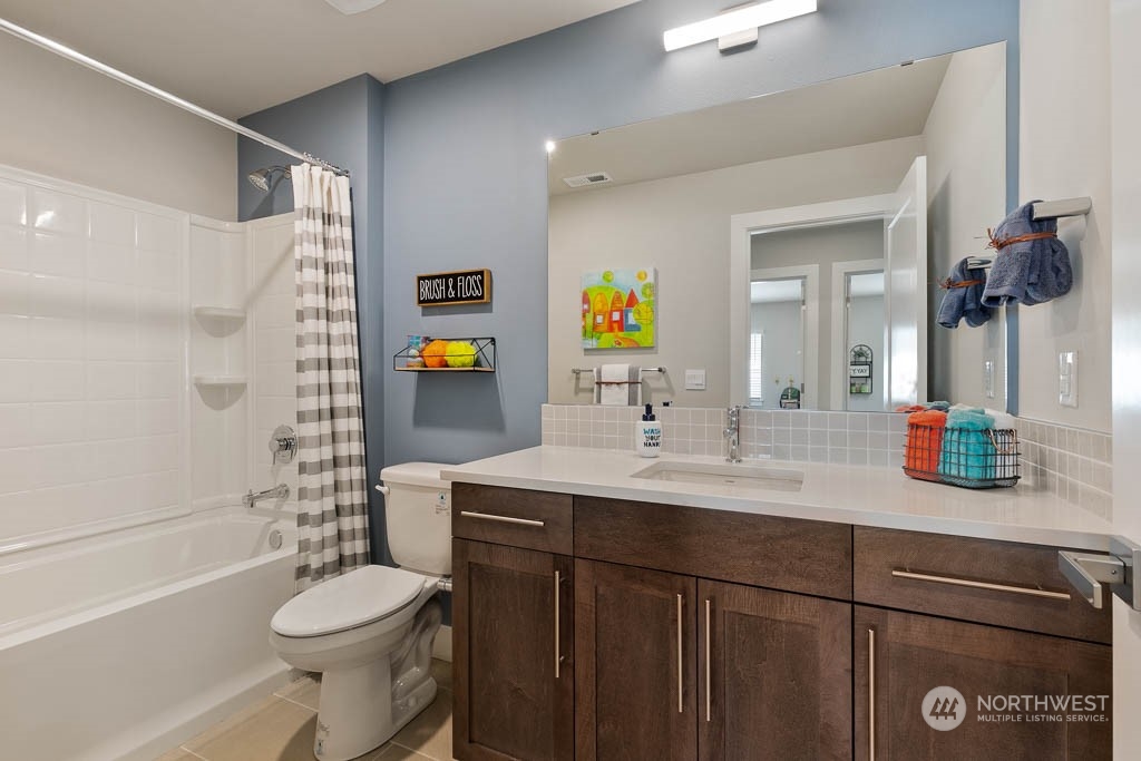 21523 6th Drive Southeast Bothell, WA 98021 - Photo 25 of 30 a bathroom with a sink a toilet and shower