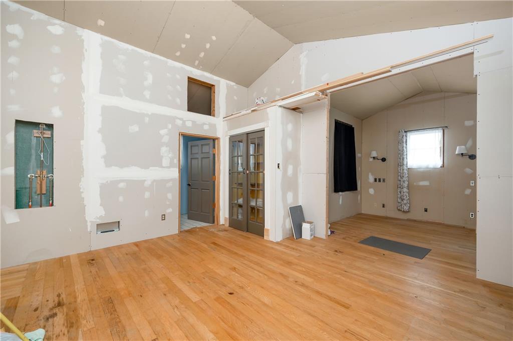 438 Main Street Prospect, PA 16052 - Photo 30 of 46 a view of a big room with wooden floor and windows
