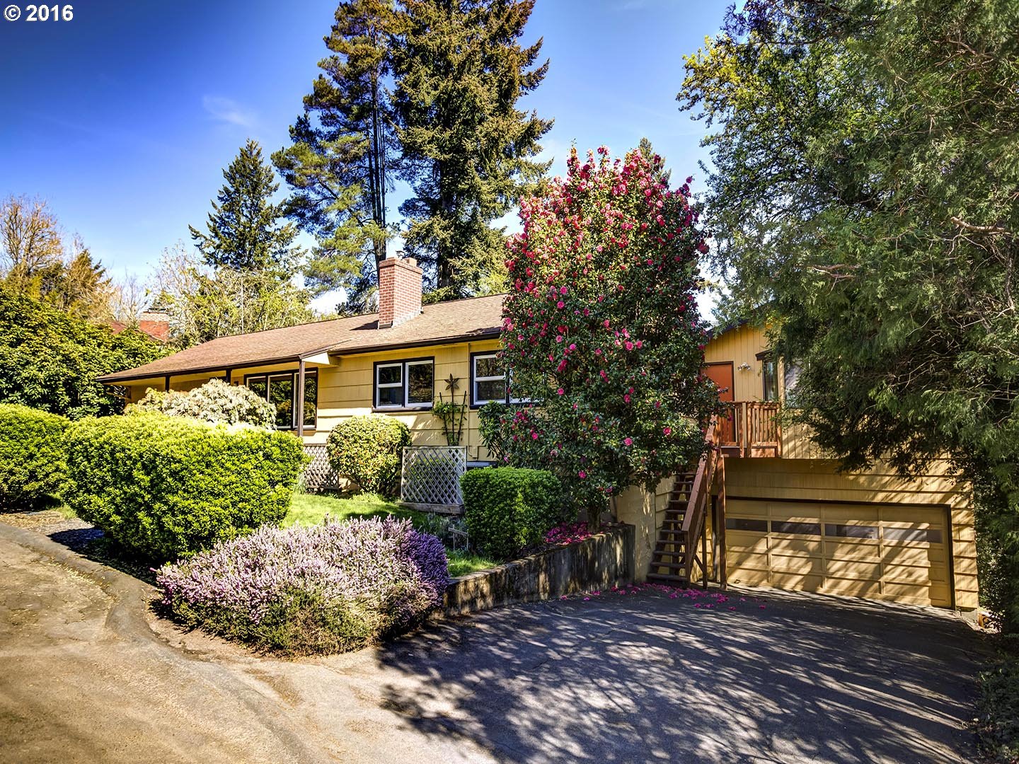 7610 Southwest Miner Way Portland, OR 97225 - Photo 1 of 32 a front view of a house with garden