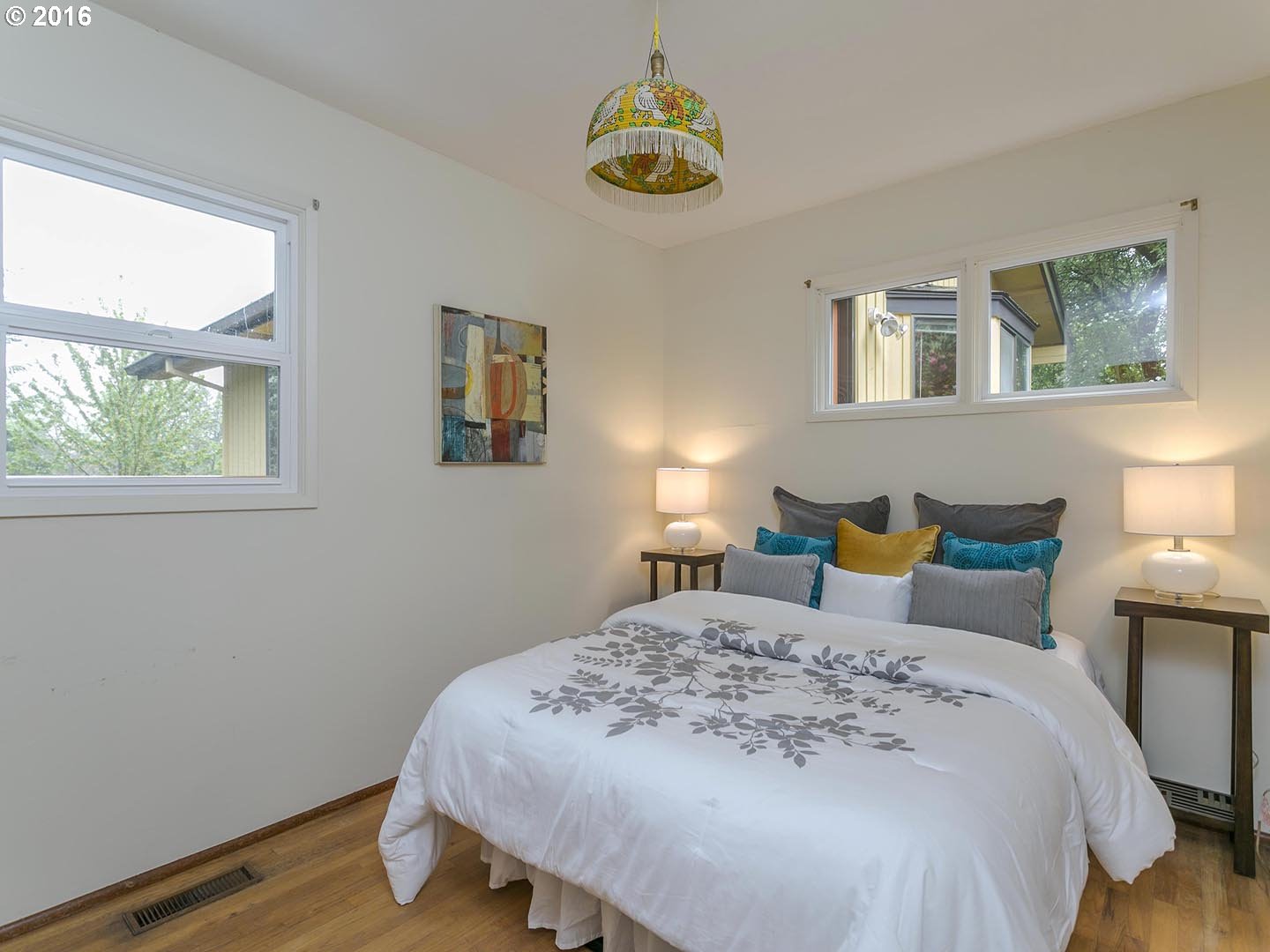7610 Southwest Miner Way Portland, OR 97225 - Photo 13 of 32 a bedroom with a bed and a window