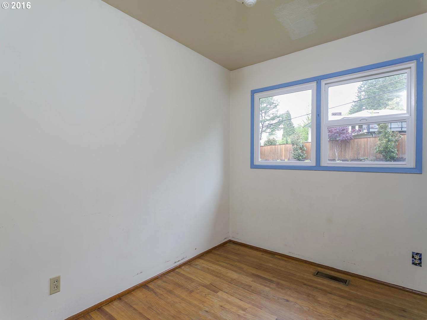 7610 Southwest Miner Way Portland, OR 97225 - Photo 14 of 32 wooden floor in an empty room with a window