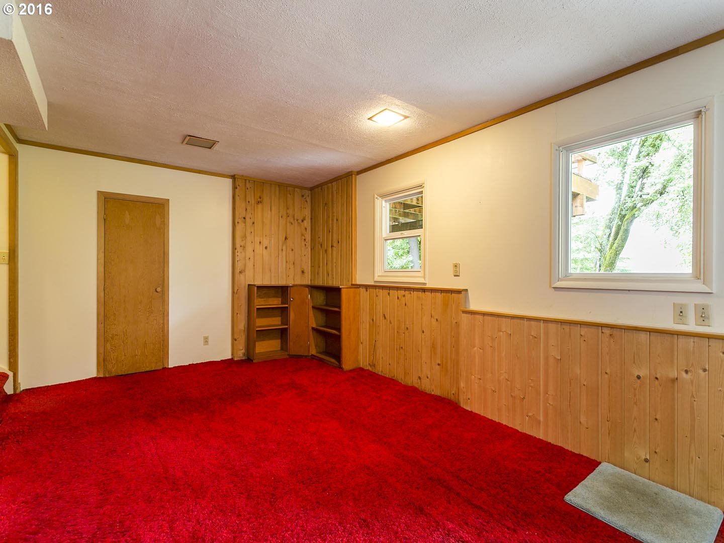 7610 Southwest Miner Way Portland, OR 97225 - Photo 17 of 32 a bed room with a bed and a window