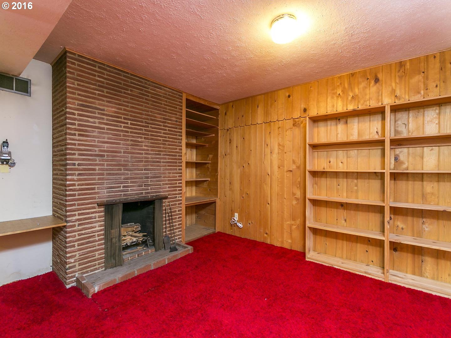 7610 Southwest Miner Way Portland, OR 97225 - Photo 18 of 32 a living room with a fireplace