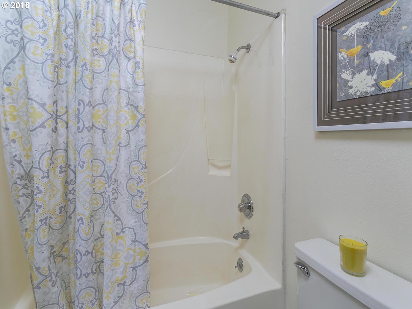 7610 Southwest Miner Way Portland, OR 97225 - Photo 21 of 32 a bathroom with a bathtub and a shower curtain