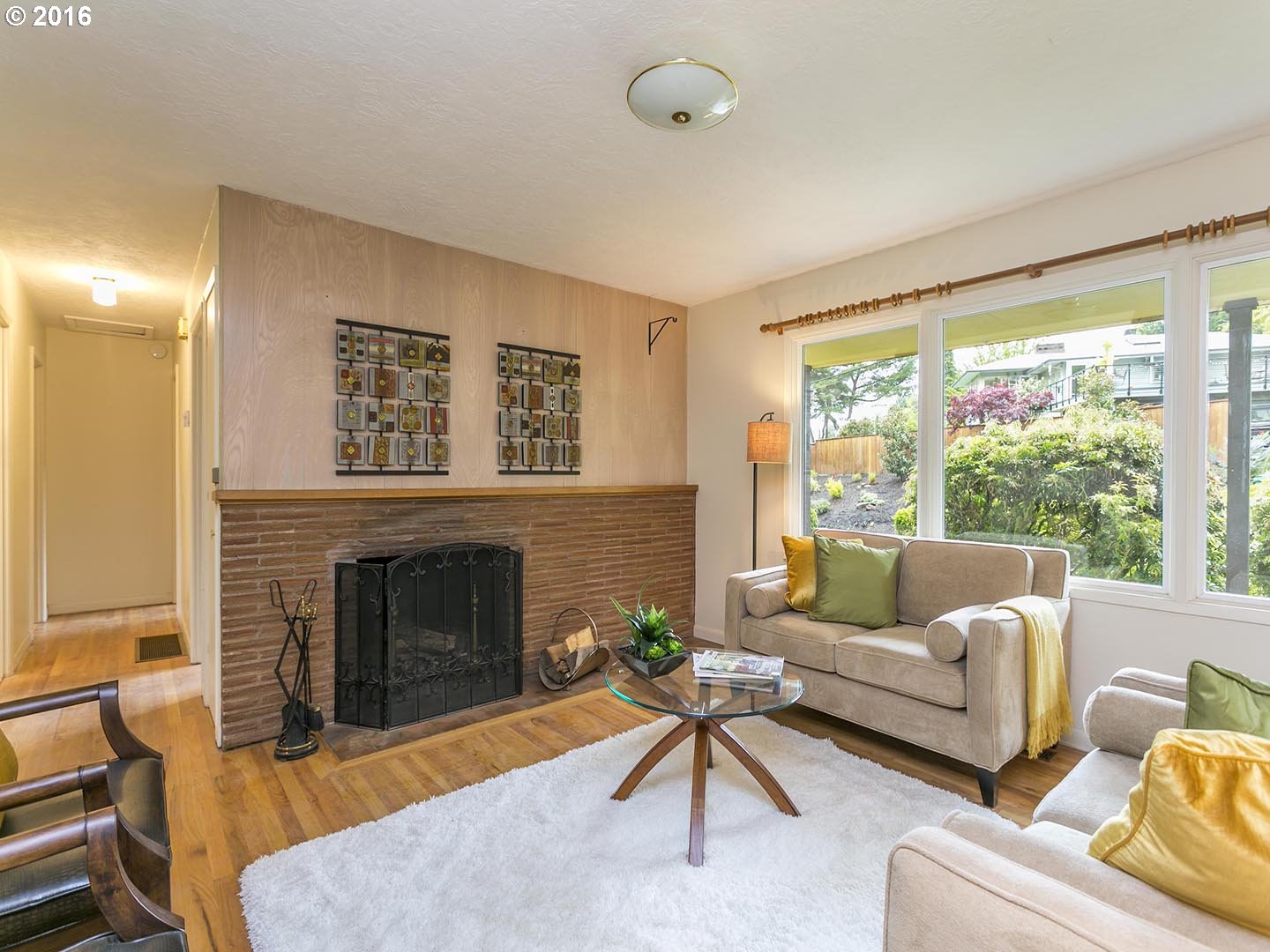 7610 Southwest Miner Way Portland, OR 97225 - Photo 3 of 32 a living room with furniture and a fireplace