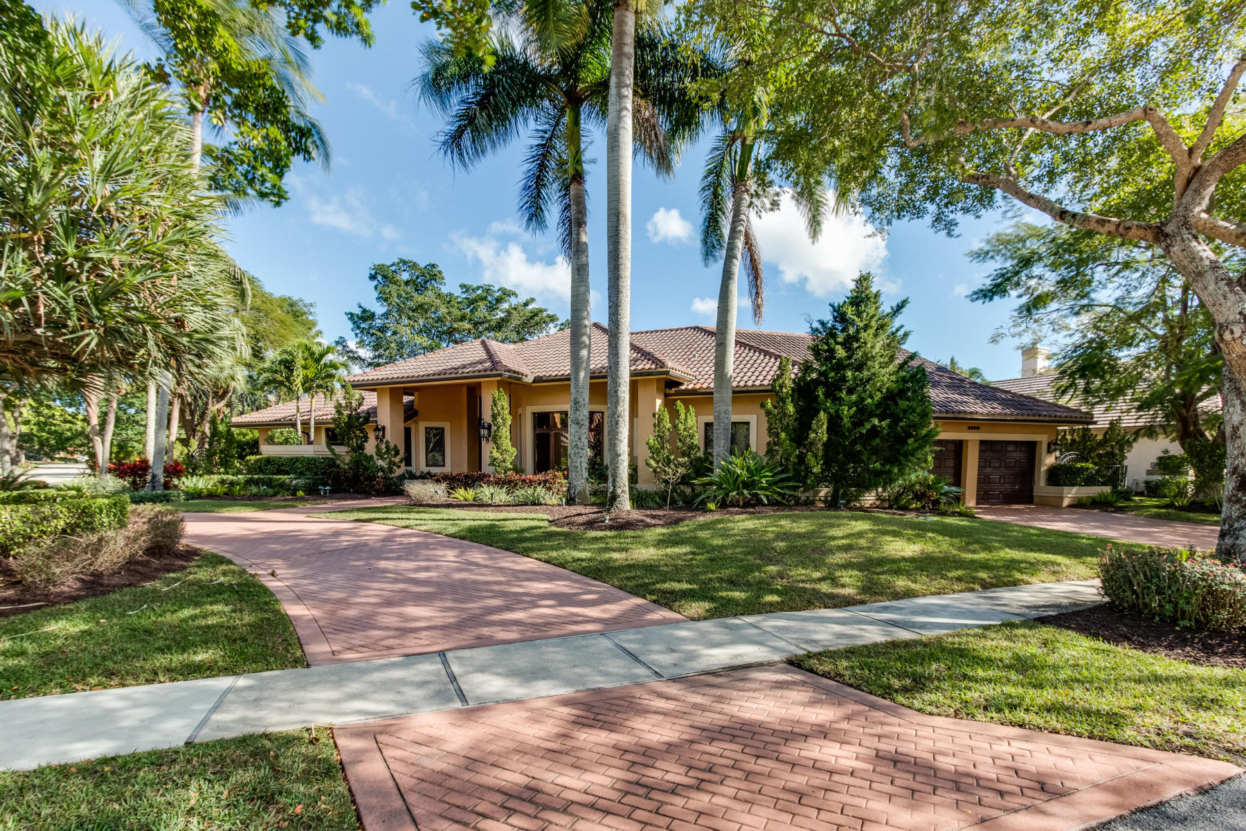 4890 Regency Court Boca Raton, FL 33434 - Photo 3 of 41 side load drive way