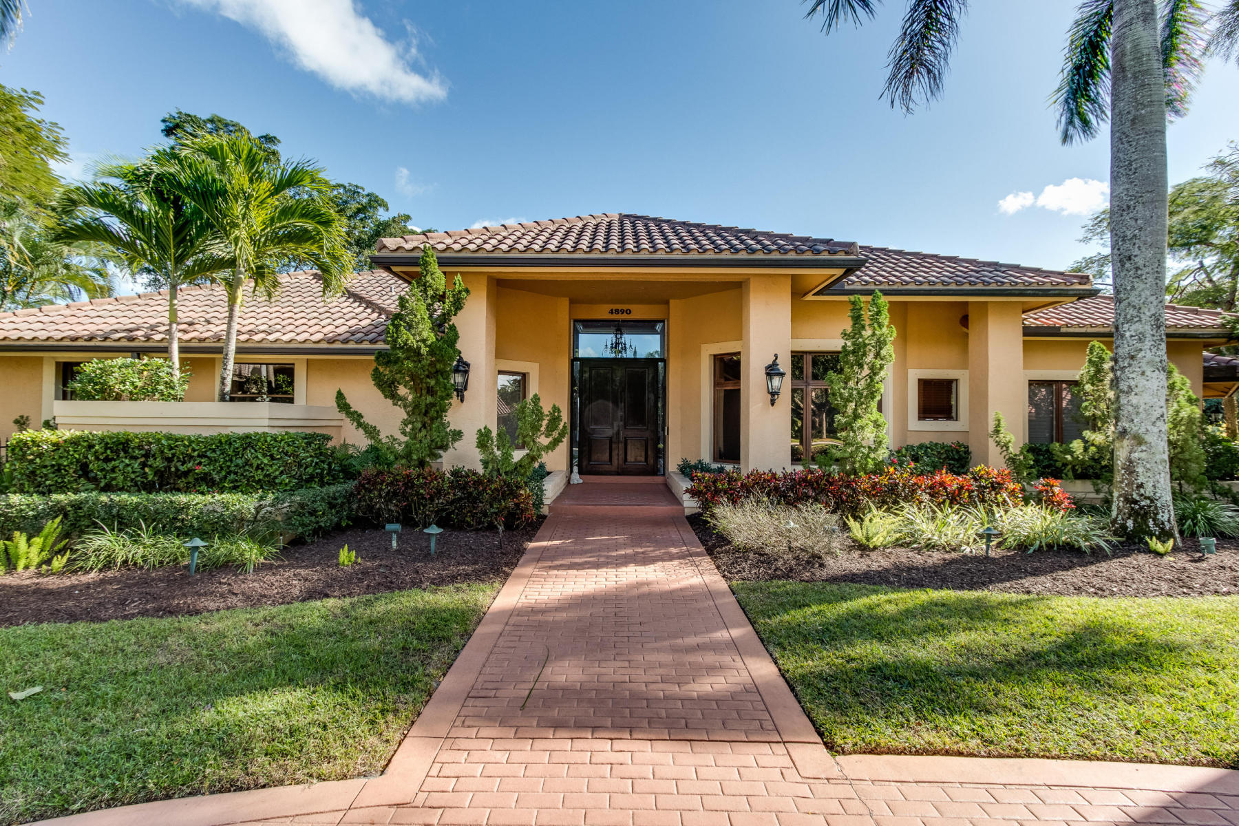 4890 Regency Court Boca Raton, FL 33434 - Photo 4 of 41 front view of Estate home