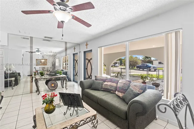 a living room with furniture and a window