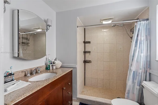 a kitchen with stainless steel appliances granite countertop a sink and a stove