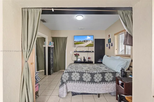 a kitchen with refrigerator and window