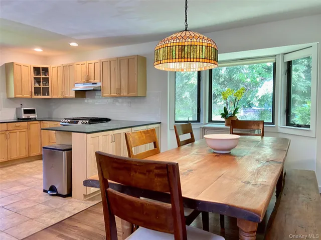 a view of a dining room with furniture window and outside view